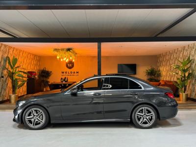 Financial Leas Mercedes-Benz C-Klasse 200 Business Solution AMG Garantie NAP Pano Camera PDC Cruise Digitale Cockpit Sfeer Clima Navi Rijklaar